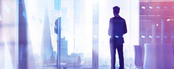 A man stands in a digitally enhanced office space