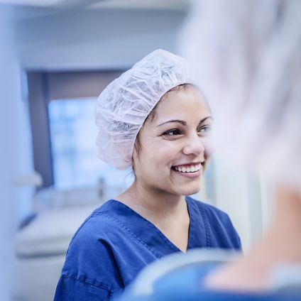 young female surgeon in hospital smiling