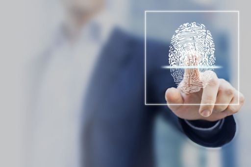Executive pressing fingerprint to screen