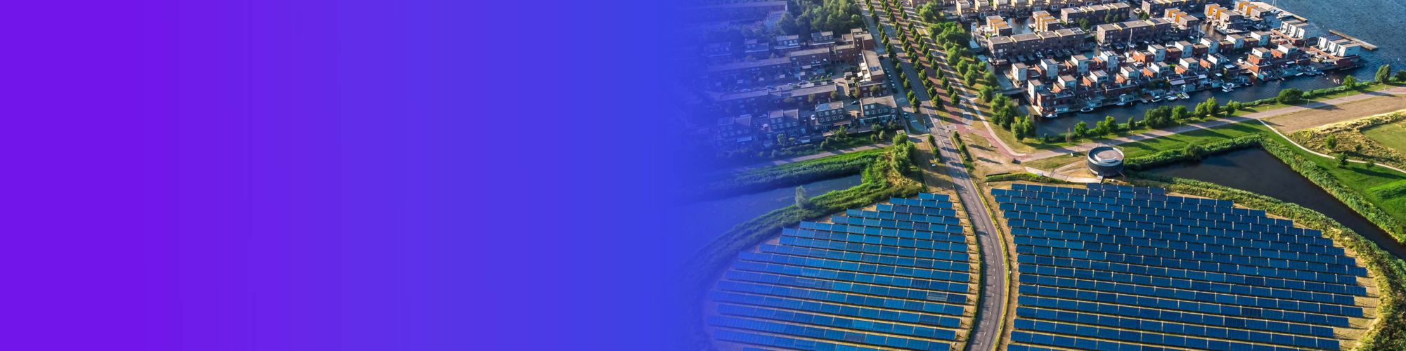 Modern sustainable neighbourhood in Almere, The Netherlands. The city heating (stadswarmte) in the district is partially powered by a solar panel island (Zoneiland). Aerial view.