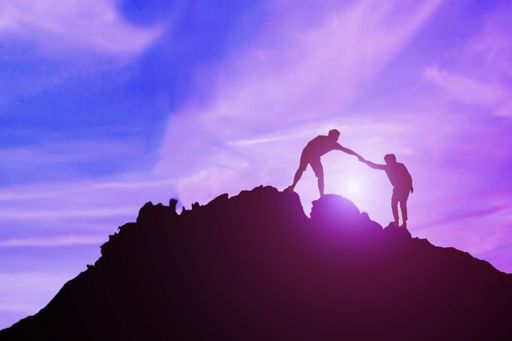 two men climbing mountain