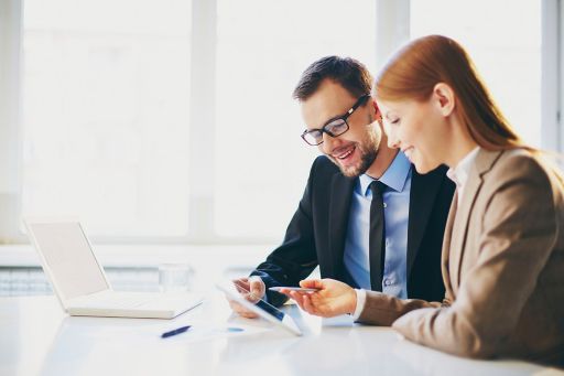 male-and-female-reading-a-document