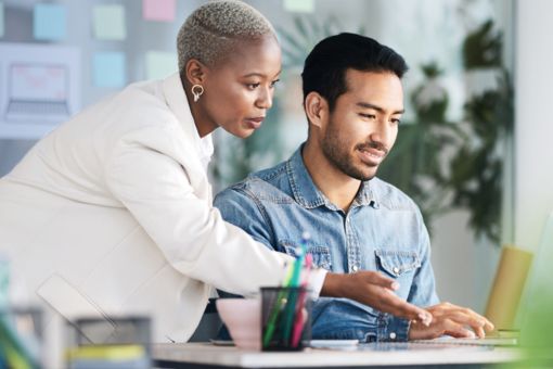 women and man on laptop