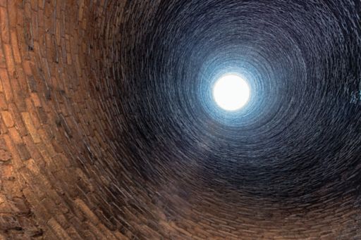 Bottom of well looking up at the light