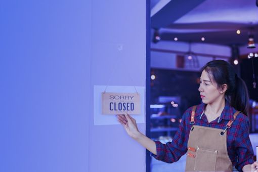 Woman holding closed board