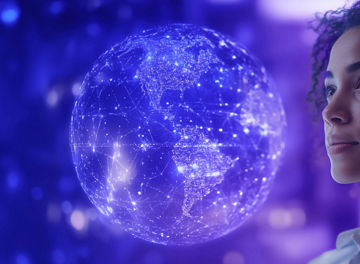 Person looking ahead at a digital earth graphic