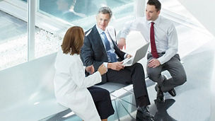 Colleagues sat discussing